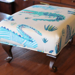 Reupholstered alligator-print footstool, $35. Available at Antique Classics.