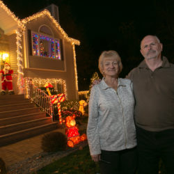 Joan and Craig Amsden in front of their Saugus home.