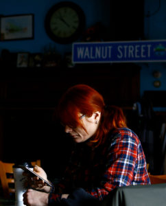 Marissa Coste enjoys a quiet moment while having a coffee at Walnut Street Café. | Photo: Mark Lorenz