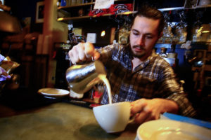 Patrick Nelson, general manager of White Rose Coffeehouse, works the counter. | Photo: Mark Lorenz